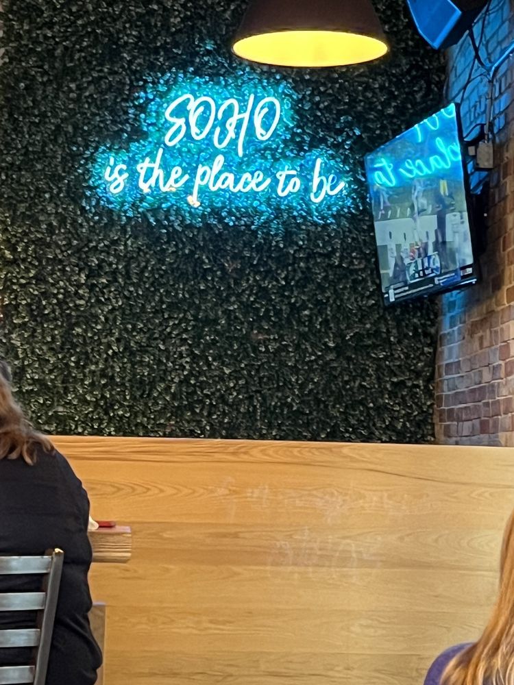 Neon SOHO is the place to be sign